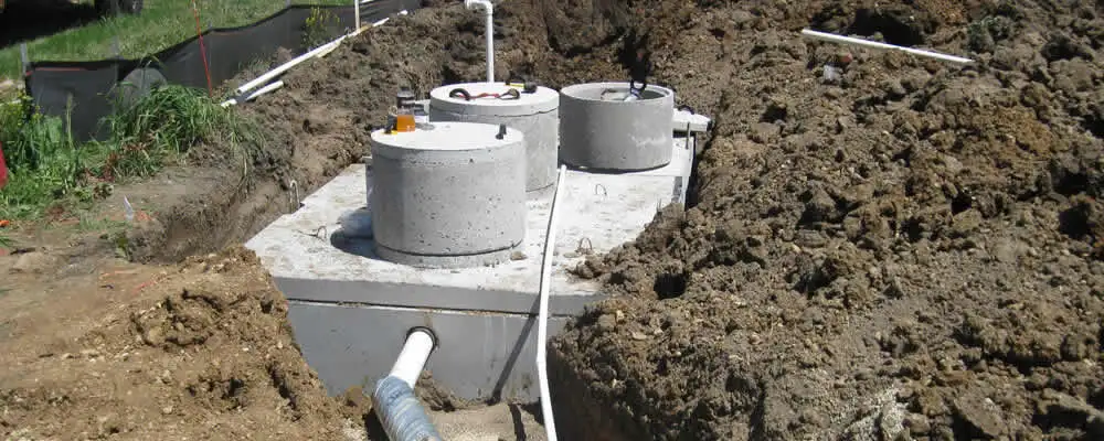 Septic system repair and installation site with tank access ports in Orlando, FL