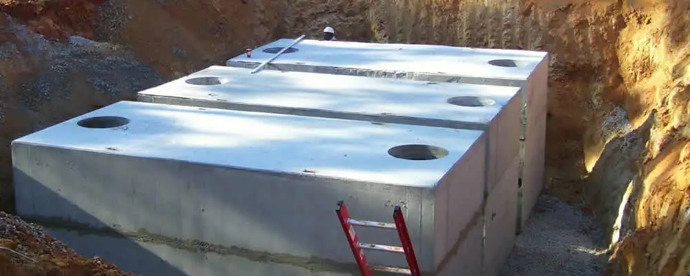 Septic tank installation site with a newly placed concrete tank in Orlando, FL